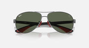 Ray-Ban aviator sunglasses, dark green lenses with red hinge accents
