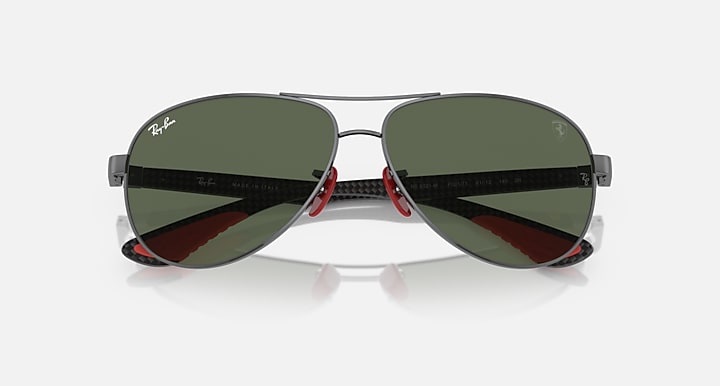 Ray-Ban aviator sunglasses, dark green lenses with red hinge accents