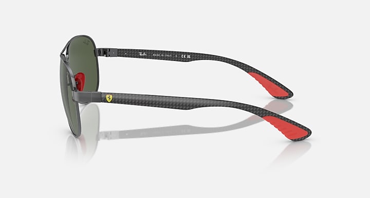 Ray-Ban aviator sunglasses side view, dark green lenses on dark metal frame