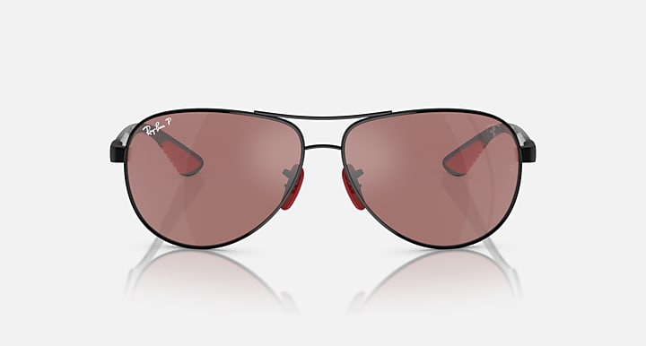 Ray-Ban aviator sunglasses, front view, rose-pink lenses with red inner accents