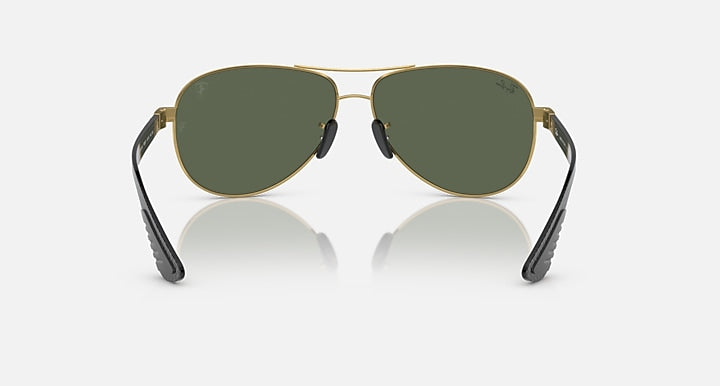 Gold-tone aviator sunglasses front view with dark green lenses and black temples