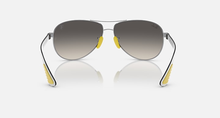Silver-tone aviator sunglasses front view with smoke lenses and yellow accents