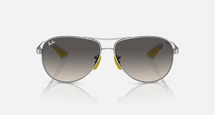 Silver-tone aviator sunglasses with dark smoke lenses and tinted mirrored finish