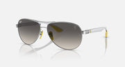Silver-tone aviator sunglasses with gradient smoke lenses and dark frame accents