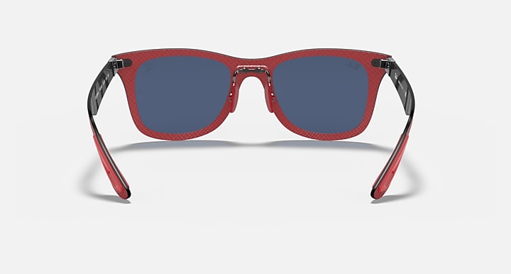 Red sunglasses with blue lenses and dark frame edges