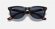Black sunglasses with blue lenses, red nose bridge and temple accents