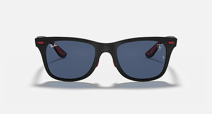 Black sunglasses with blue lenses and red temple details