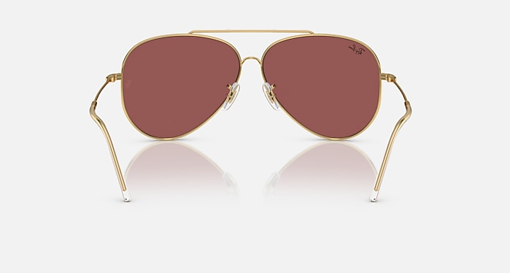 Ray-Ban aviator sunglasses with gold frame and maroon mirrored lenses, front view.