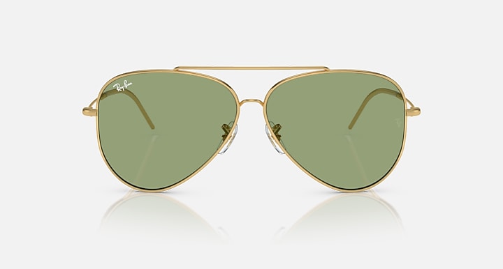 Ray-Ban aviator sunglasses, gold frame with green lenses and wire temples.