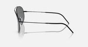 Aviator sunglasses side profile with dark gray lenses and thin metal temples