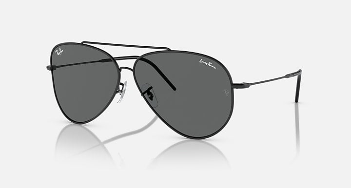 Aviator sunglasses with dark gray lenses and dark metal frames, hinge detail