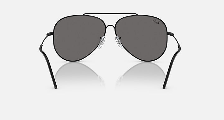 Ray-Ban aviator sunglasses with dark grey lenses and black frame, straight-on view.