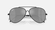 Ray-Ban aviator sunglasses with dark grey lenses and black frame, close front view.