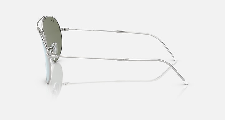 Aviator sunglasses side profile with light blue lenses and silver metal temples