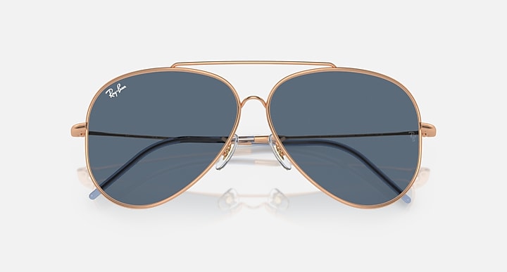 Ray-Ban aviator reverse sunglasses, front view, rose-gold frame with dark blue lenses