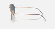 Ray-Ban aviator sunglasses side view with rose gold frame and dark blue lens