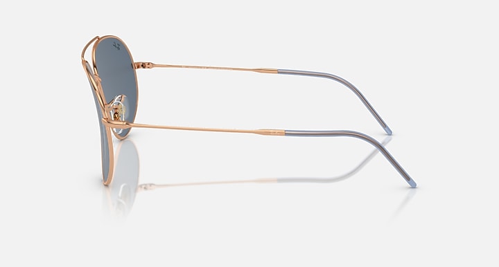 Ray-Ban aviator reverse sunglasses, side view, rose-gold frame with blue lenses