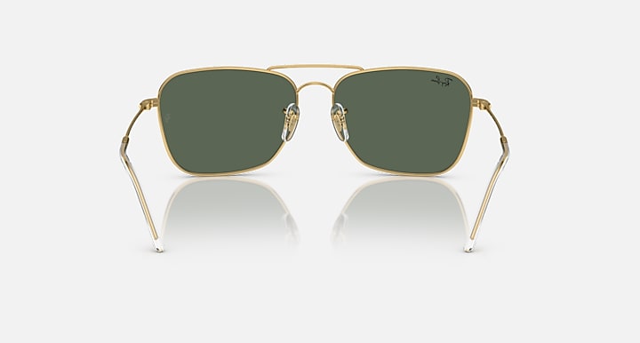 Ray-Ban Caravan Reverse sunglasses with dark green lenses and gold-tone frame, front view.