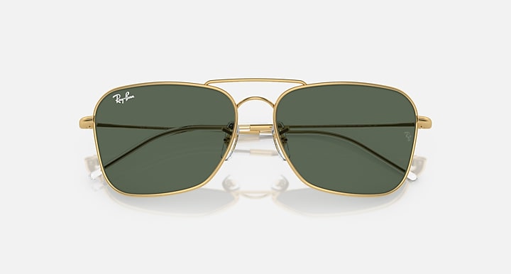 Ray-Ban Caravan Reverse sunglasses with dark green lenses and gold-tone frame, top angle.