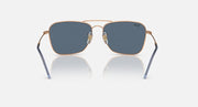 Caravan Reverse sunglasses with rose gold rims, blue temples, and dark blue lenses