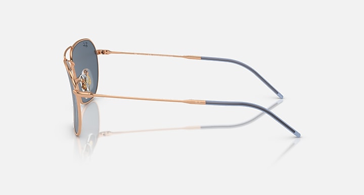 Caravan Reverse sunglasses side view with rose gold frame and dark blue lens