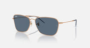 Caravan Reverse sunglasses with rose gold frames and dark blue rectangular lenses