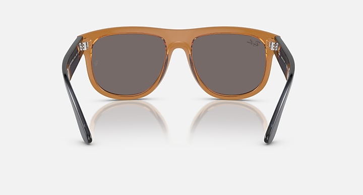 Ray-Ban brown and black sunglasses with dark gray lenses and angular frames