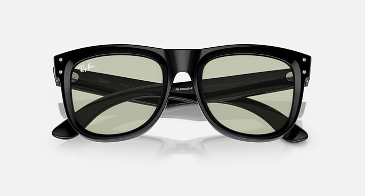 Ray-Ban Wayfarer sunglasses, front view with black frame and muted green-tinted lenses