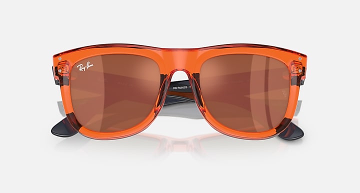 Ray-Ban Wayfarer Reverse sunglasses, orange frame, brown tinted lenses, angled front