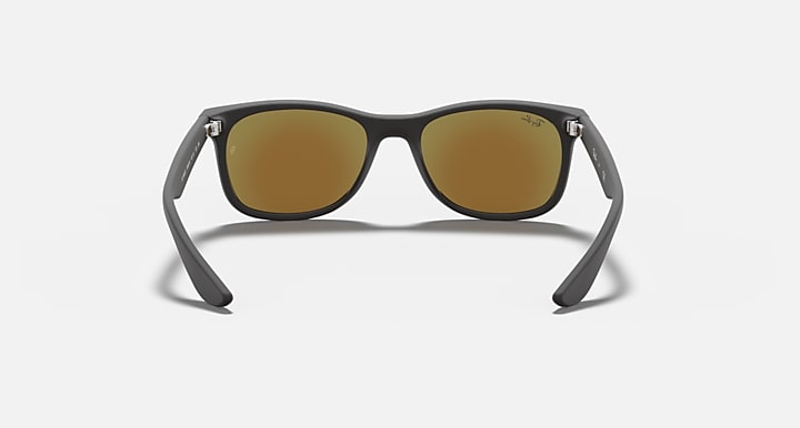 Ray-Ban Jr MOD. 9052S sunglasses with dark frame and amber-brown lenses