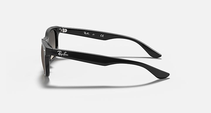 Ray-Ban Junior wayfarer sunglasses, transparent gray frame, side view