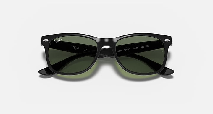 Black sunglasses with green lenses and etched logo on temples, front view