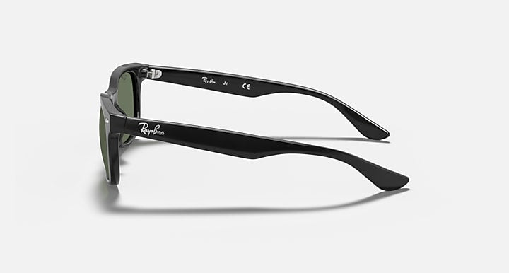 Black Wayfarer sunglasses with green lens tint and curved temple, side view