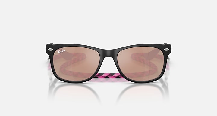 Ray-Ban Junior Wayfarer sunglasses, front view; pink patterned temples with brown lenses.