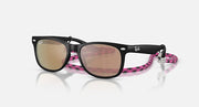 Ray-Ban Junior Wayfarer sunglasses with black frame, pink patterned temples, brown lenses.