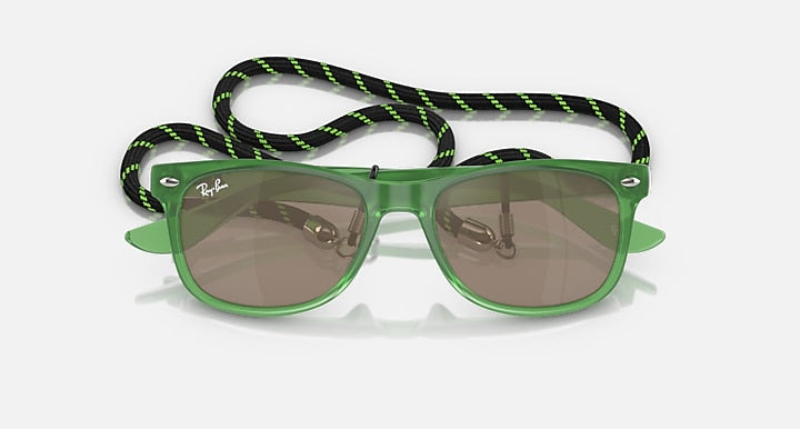Ray-Ban junior wayfarer sunglasses with green frames, darker lenses, patterned neck strap