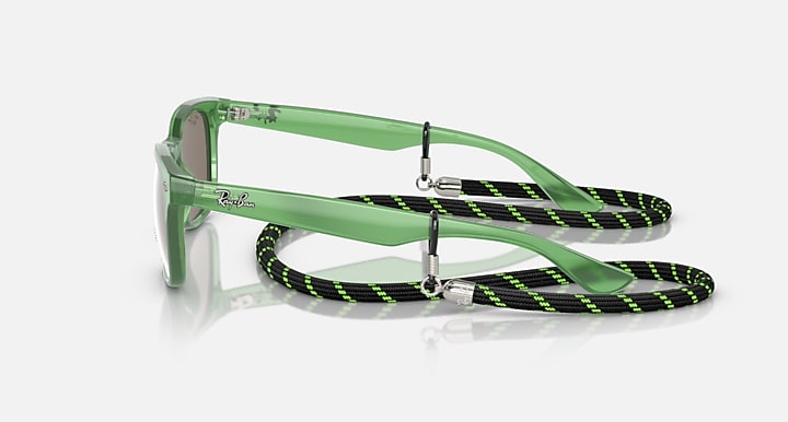 Ray-Ban junior wayfarer sunglasses with green frames and striped neck strap, side view