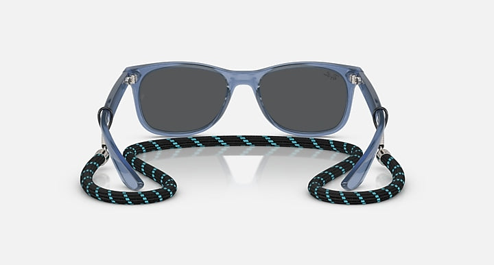 Ray-Ban junior wayfarer sunglasses with blue frames and dark-tinted lenses, angled view