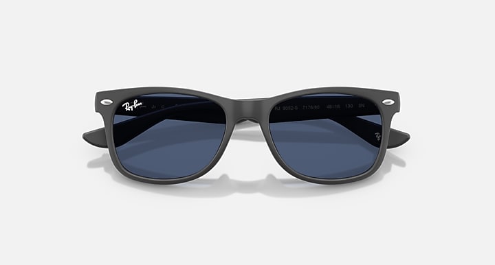 Ray-Ban Junior Wayfarer sunglasses, front view; dark frame with deep blue lenses.