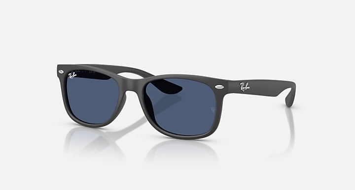 Ray-Ban Junior Wayfarer sunglasses with dark frame and blue tinted lenses.