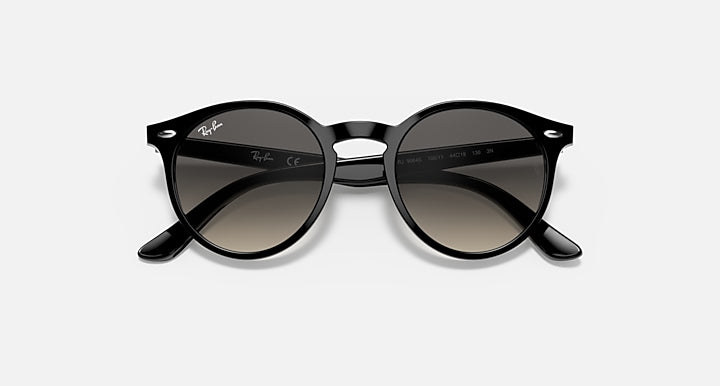Ray-Ban RJ9064S sunglasses with black round frame and dark gradient lenses