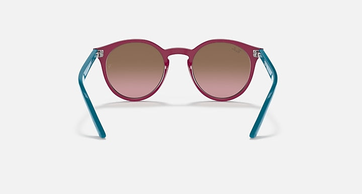 Purple round sunglasses with rose-tinted lenses and teal arms.