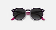 Black round sunglasses with dark lenses and magenta temple accents.