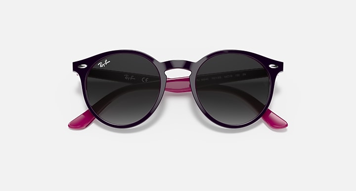 Black round sunglasses with dark lenses and magenta temple accents.