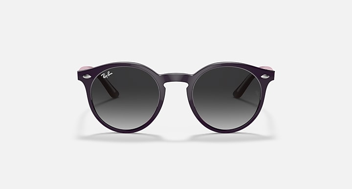 Dark round sunglasses with dark lenses and minimalist frame detailing.