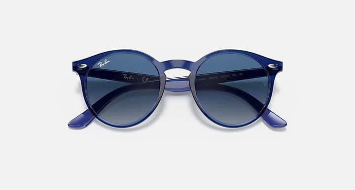 Ray-Ban sunglasses, slightly angled: deep blue frame with dark blue gradient lenses