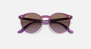 Ray-Ban round sunglasses with purple frame and dark gradient lenses, angled
