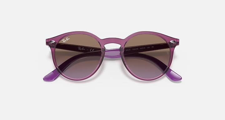 Ray-Ban round sunglasses with purple frame and dark gradient lenses, angled