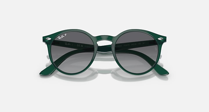 Ray-Ban RJ9064S round sunglasses with green frames and dark tinted lenses