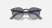 Ray-Ban RJ9064S round sunglasses, angled view, with dark lenses and grey frames